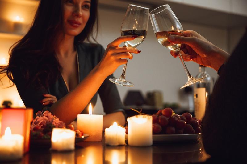elegant dinner setting with wine and candlelight during a high-class escort experience