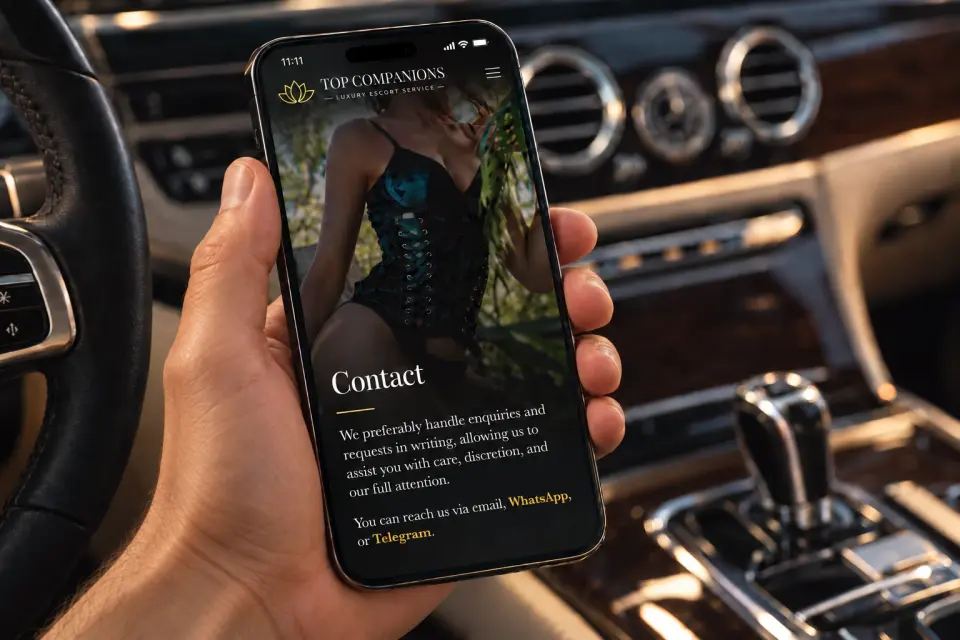 Man viewing the Top Companions contact page in a luxury car – representing intentional, respectful communication.