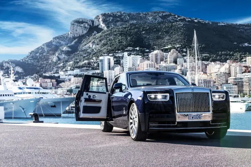 Rolls-Royce parked in Monaco’s yacht harbour, symbolising elite lifestyle and high-class escort experiences in Monte-Carlo.