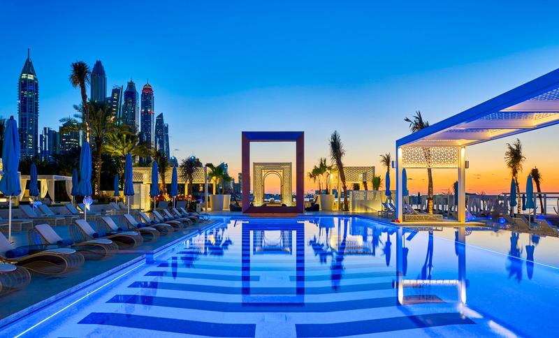 Luxury Dubai beach club infinity pool and skyline setting ideal for high class escort companion experiences